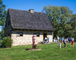 People visiting the 1719 Herr House.