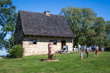 People visiting the 1719 Herr House.