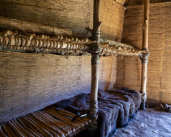 A view of the sleeping bunks in the longhouse.